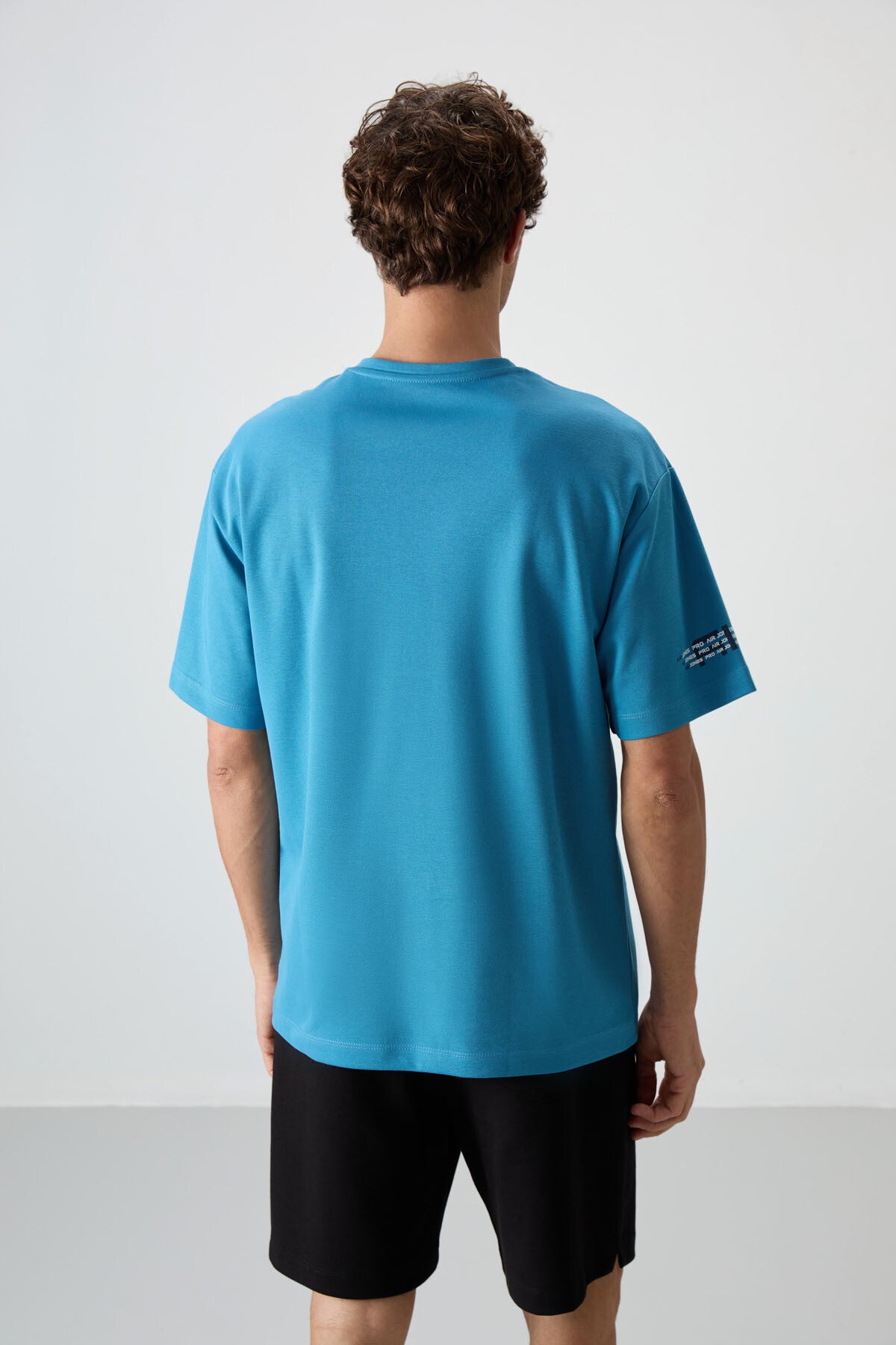 Image of Petrol Mavi Pamuklu Kalın Yüzeyi Dokulu Oversize Fit  Baskılı Erkek T-Shirt - 88369