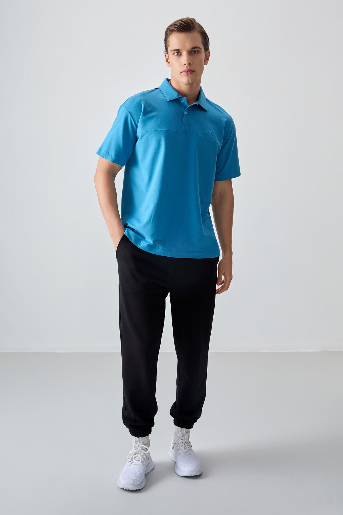 Image of Tricou bărbătesc albastru-petrol, gros, texturat, cu guler polo, croială supradimensionată, stil basic - 88382