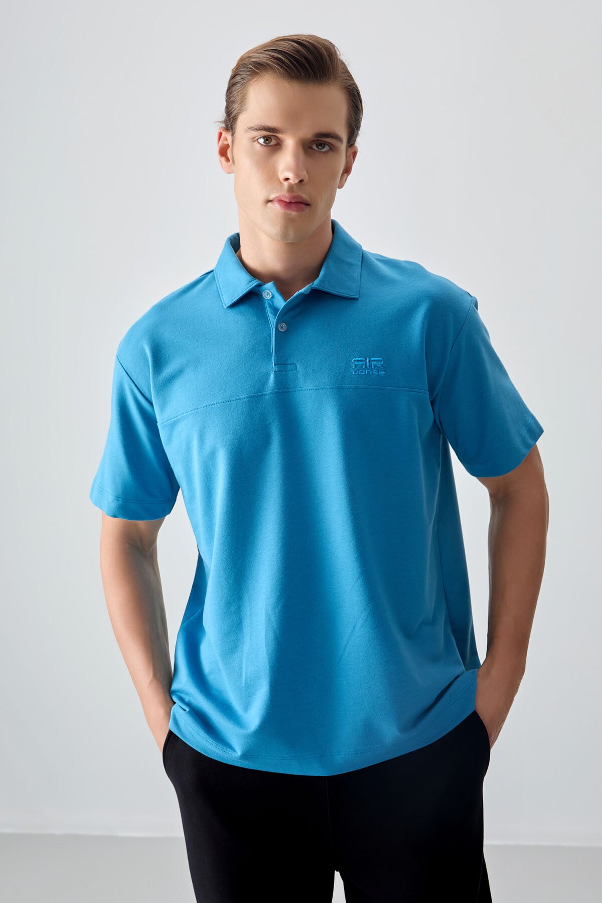 Image of Tricou bărbătesc albastru-petrol, gros, texturat, cu guler polo, croială supradimensionată, stil basic - 88382