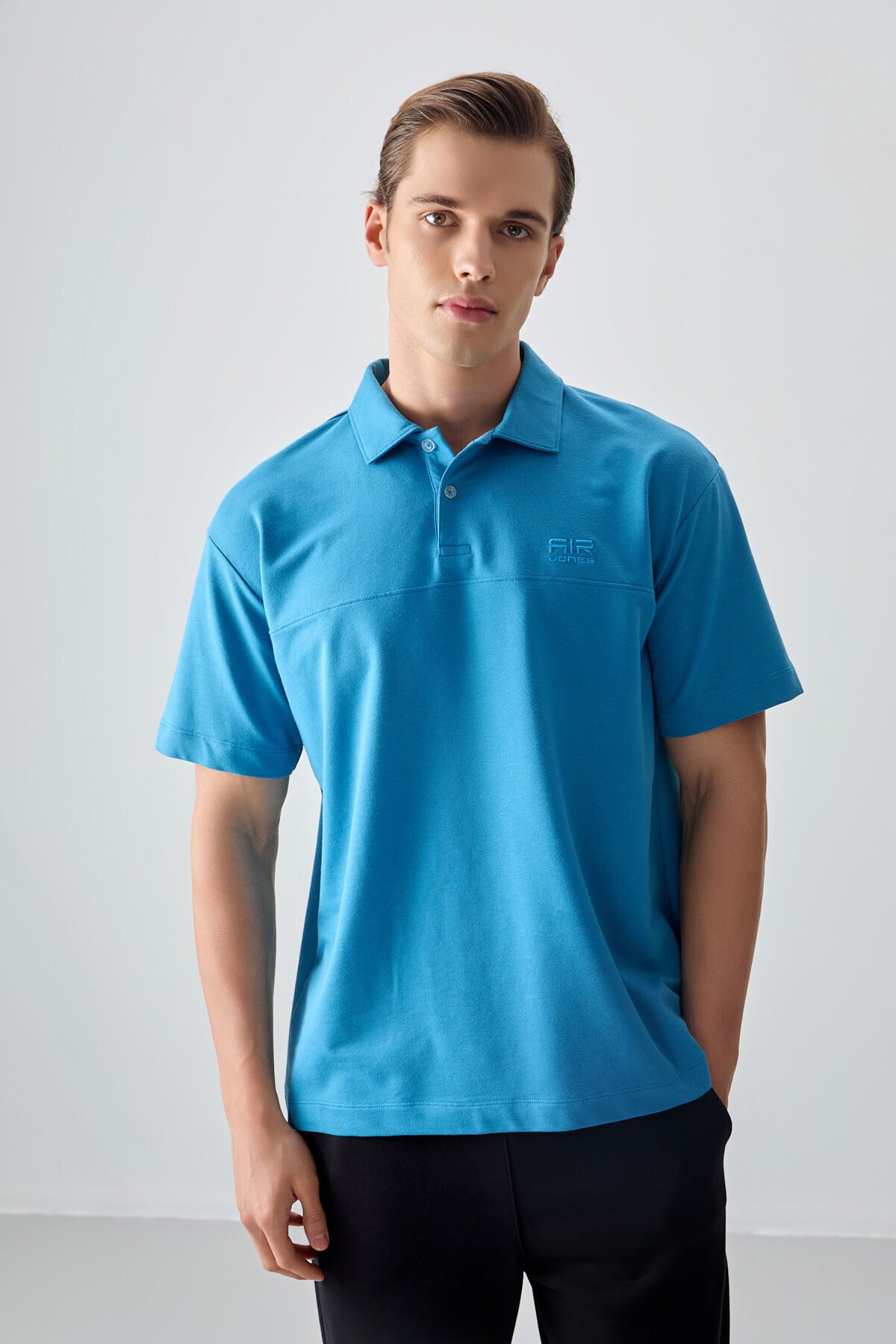 Image of Tricou bărbătesc albastru-petrol, gros, texturat, cu guler polo, croială supradimensionată, stil basic - 88382