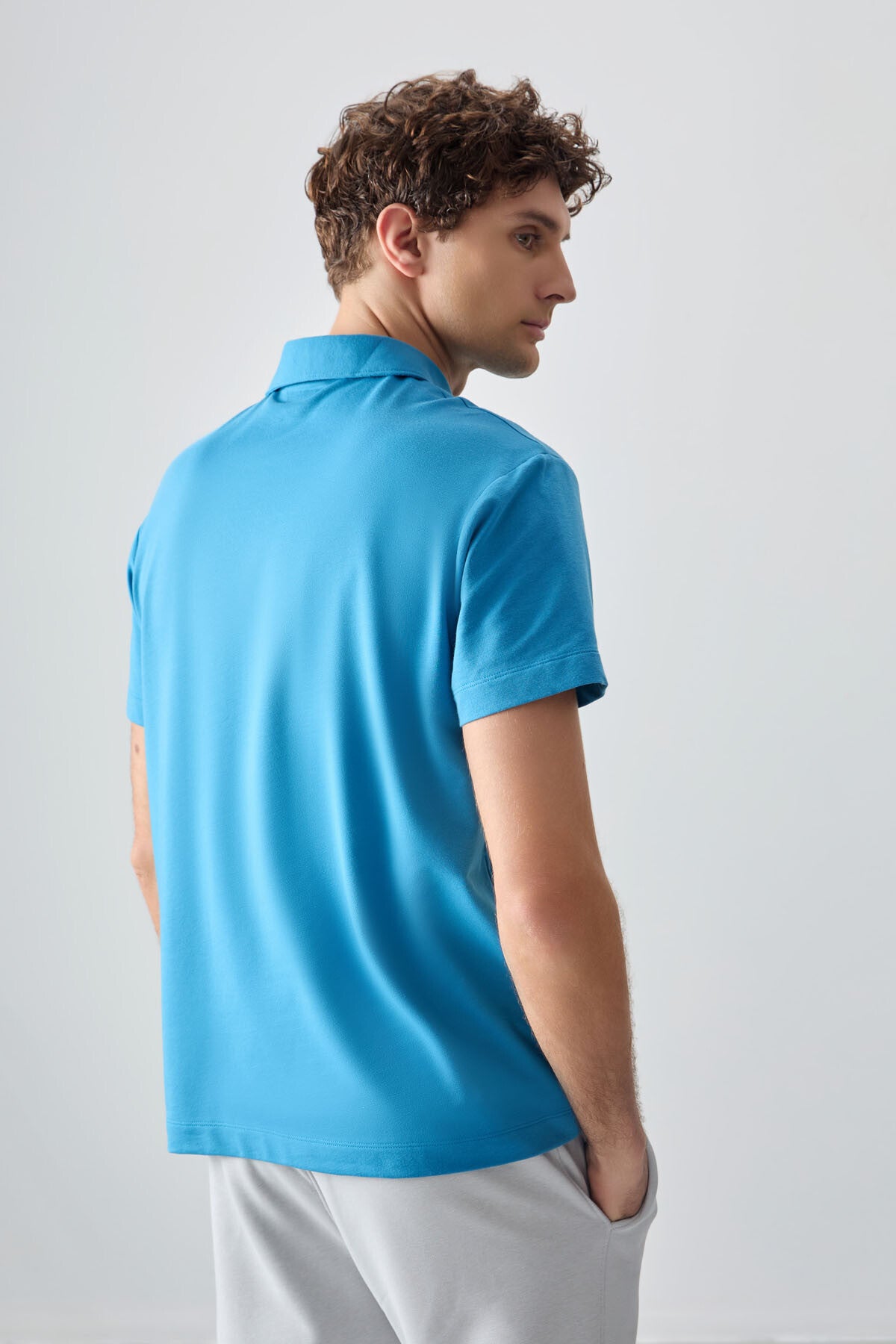 Image of Tricou bărbătesc albastru-petrol, gros, texturat, cu guler polo, croială supradimensionată, stil basic - 88381