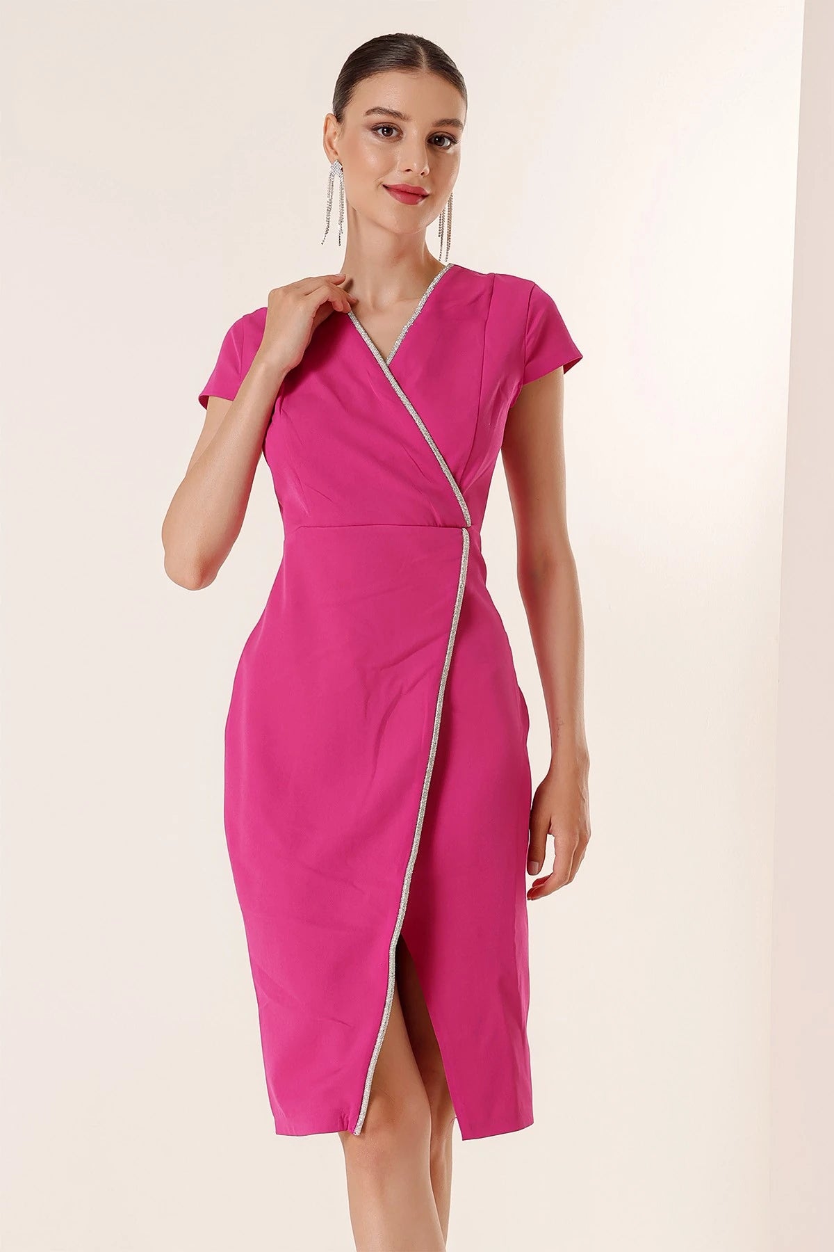 Image of Wrap-neck, half-moon sleeve dress with stone details and front slit.