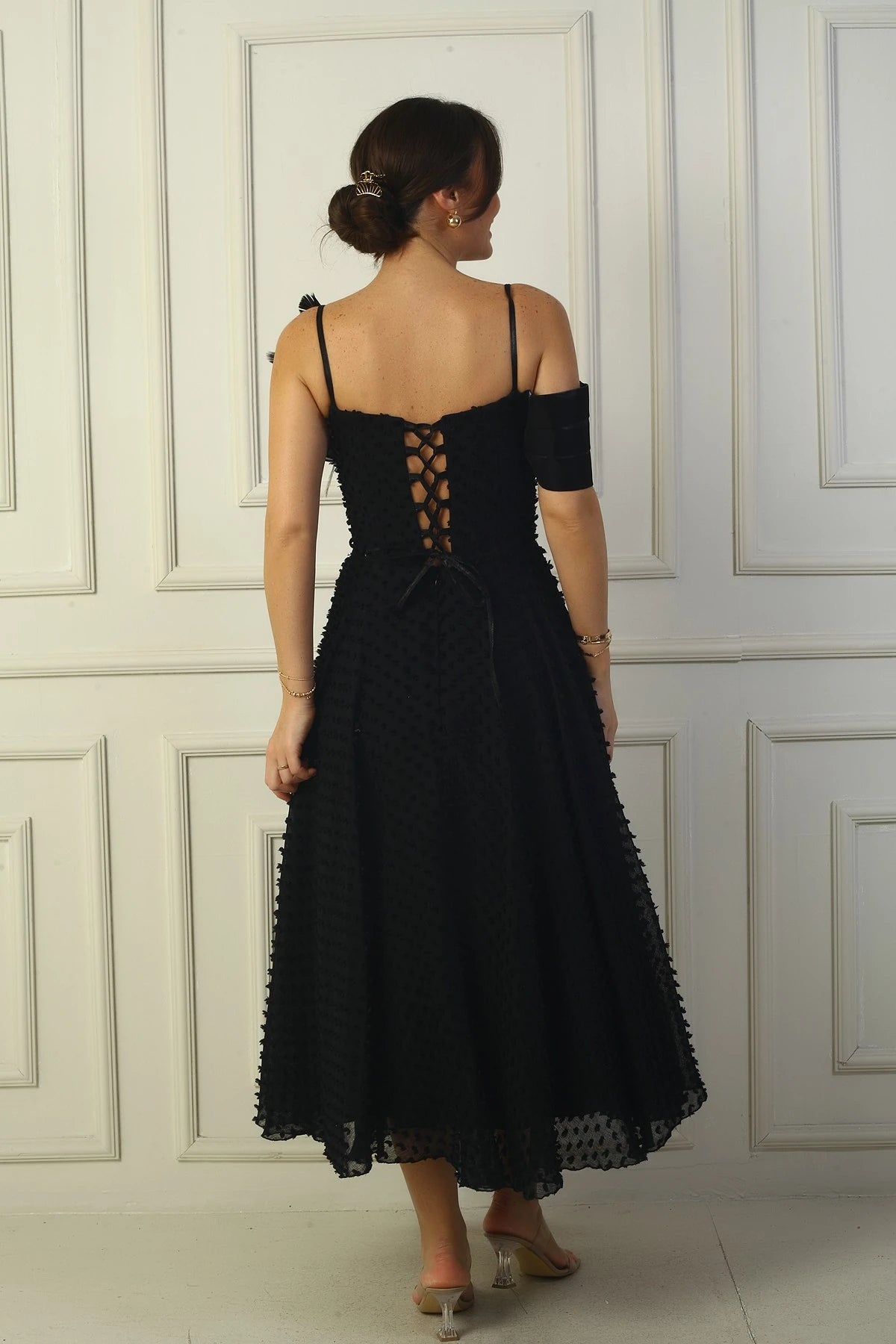 Image of Women's Strappy, Back Lace-Up, Dropped One-Sleeve Dress with Feather Brooch, Lined, and Glossy Fabric.