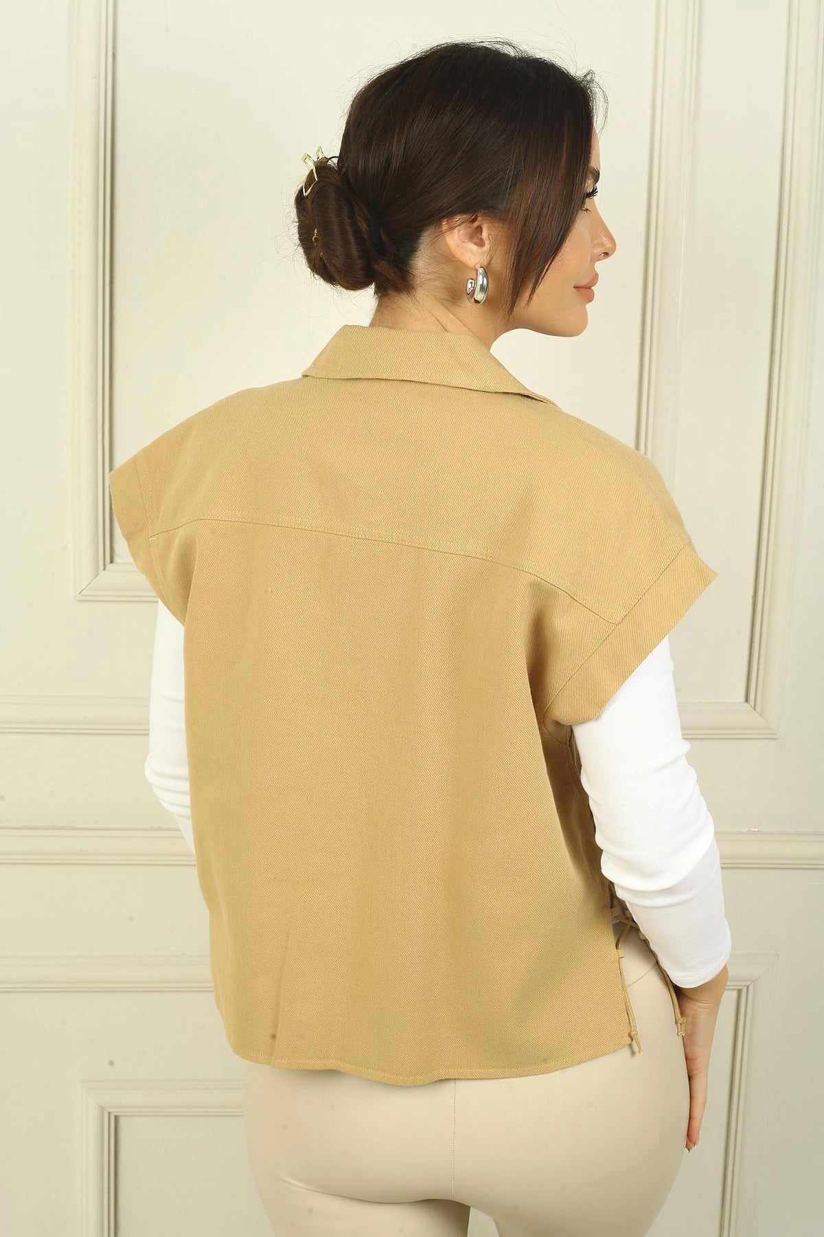 Image of Women's Dropped Sleeve Vest with Side Laces and Metal Buttons at the Front