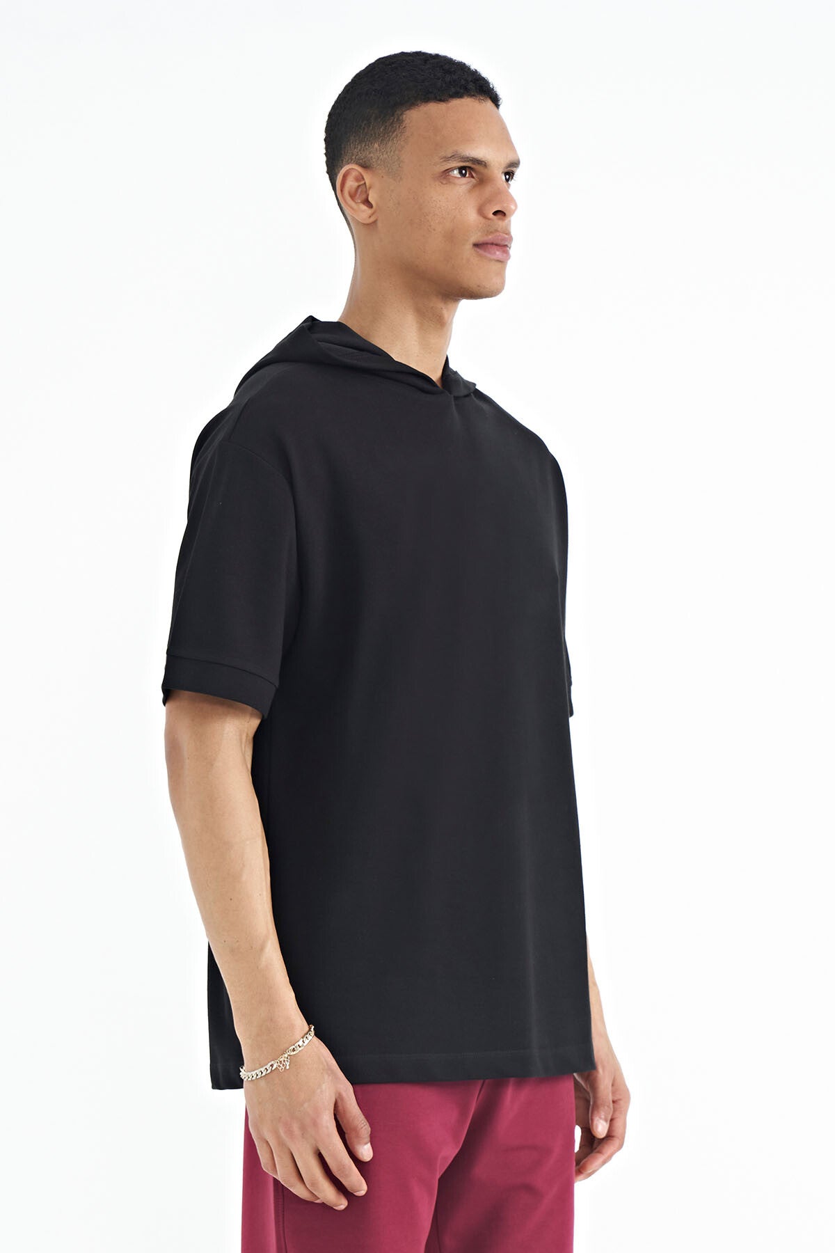 Image of Black Hooded Oversize T-shirt with Sleeve Label Detail for Men - 88179